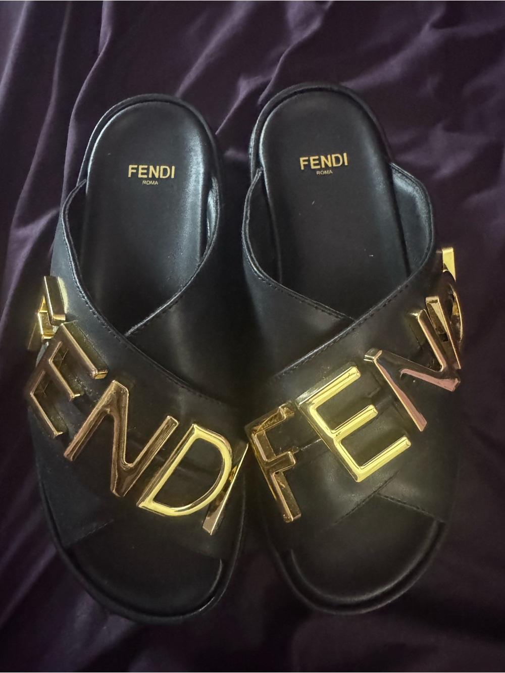 Fendi Black Leather Slides with Gold Logo Accents